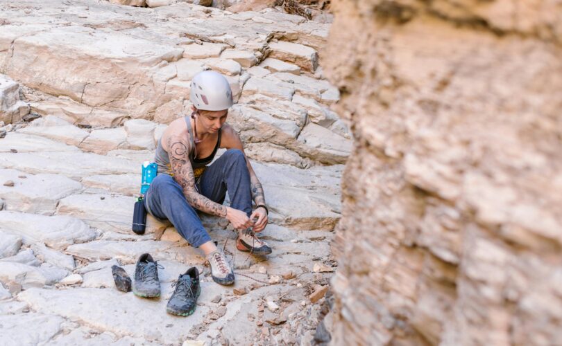 Photo by RDNE Stock project: https://www.pexels.com/photo/a-rock-climber-tying-her-shoelaces-7187973/